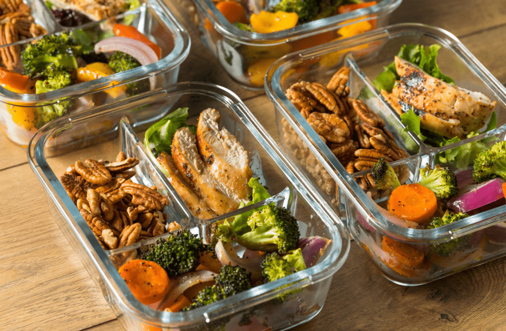 Nutritional meal preparation in portioned containers, designed for fitness and health-conscious individuals. These organized meals support a balanced diet and fitness goals.